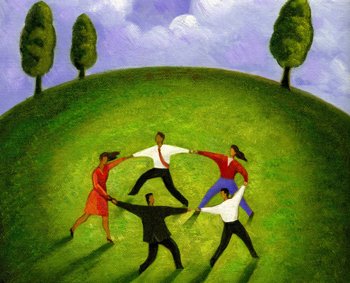 Five business people linking hands in a circle